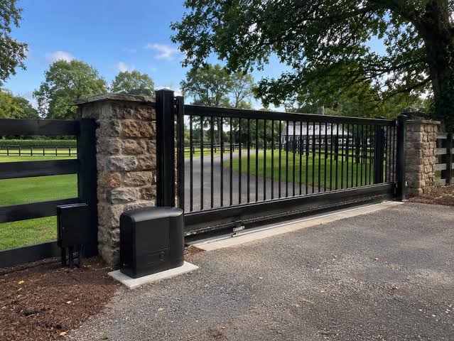 Fence Replacement in Liverpool - NY in progress as a crew removes old panels and sets new posts